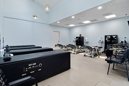 Second Dalton treatment room with therapy tables and chiropractic equipment.